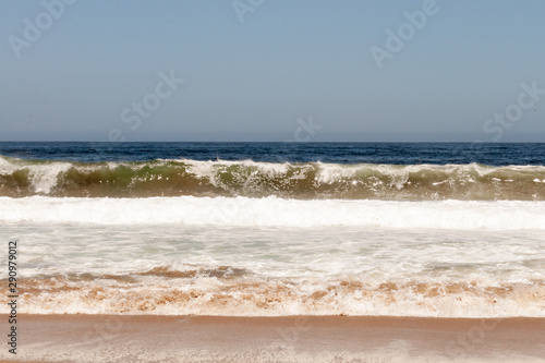 stripes of nature, sky, deep sea, waves, white foam and sand
