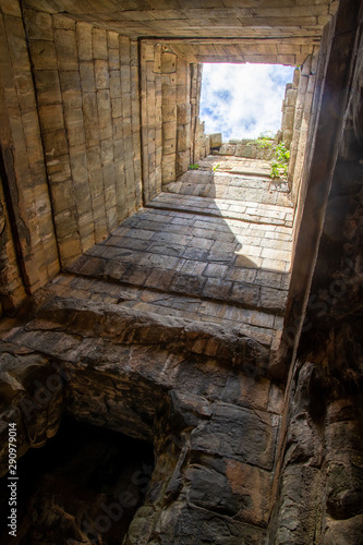 Fototapeta Naklejka Na Ścianę i Meble -  Architectural detail, looking up at sky though building, Angkor Wat, Cambodia