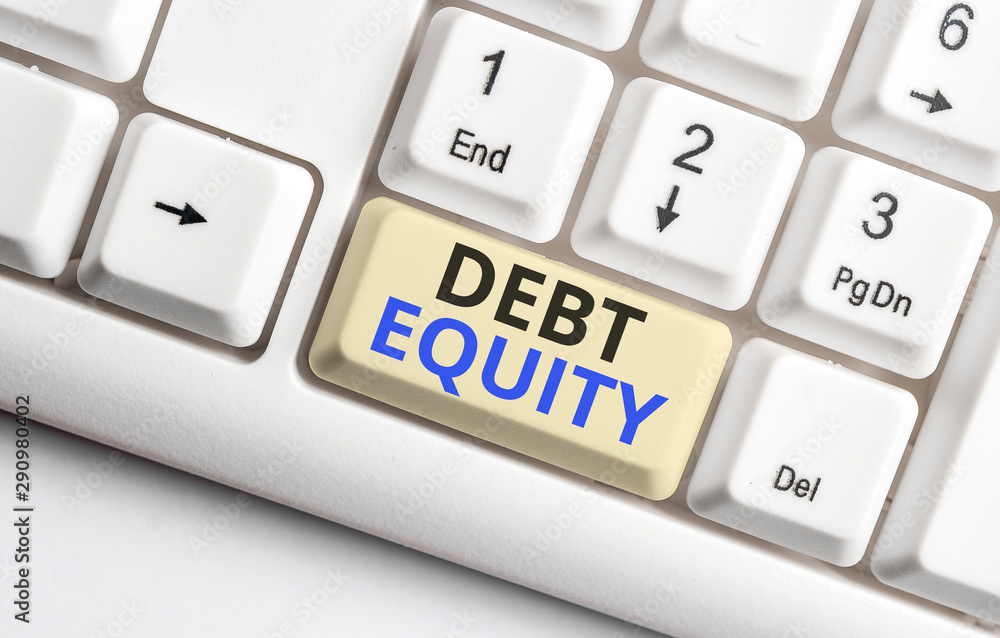 Text sign showing Debt Equity. Business photo showcasing dividing companys total liabilities by its stockholders White pc keyboard with empty note paper above white background key copy space Text sign showing Debt Equity. Business photo showcasing dividing companys total liabilities by its stockholders White pc keyboard with empty note paper above white background key copy space