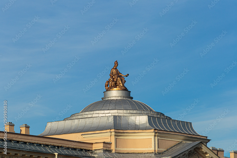 Sculpture of Roman goddess of the mind Minerva, patroness of crafts and arts, surrounded by three geniuses of arts, decorates the building of the Museum of the Russian Academy of arts.