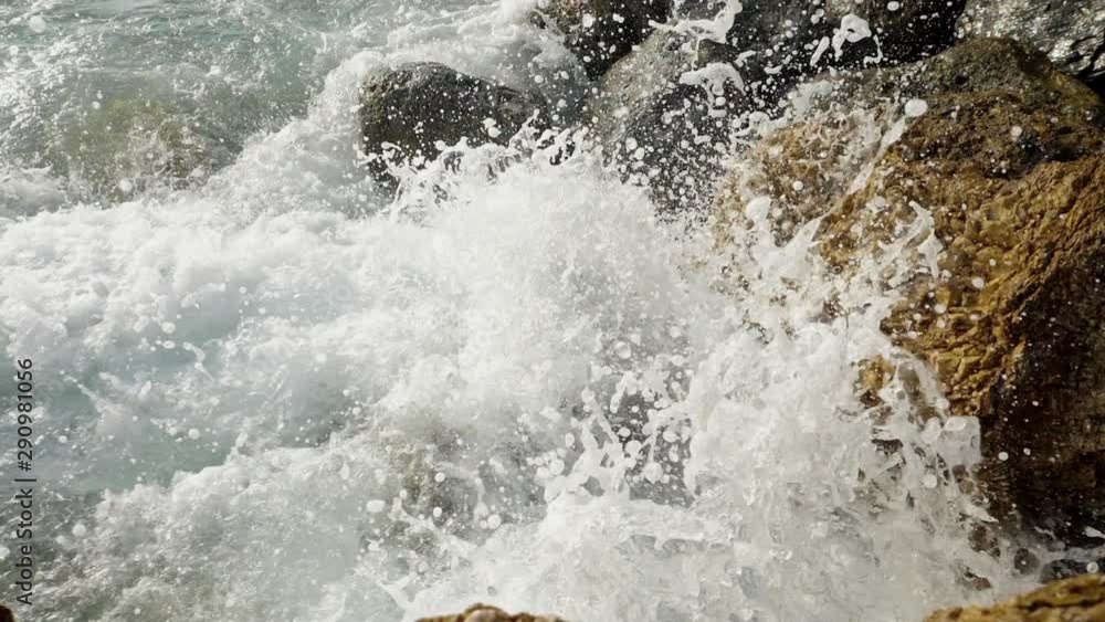 Sea waves crashing on stone beach. Sea waves crashing on stone beach.