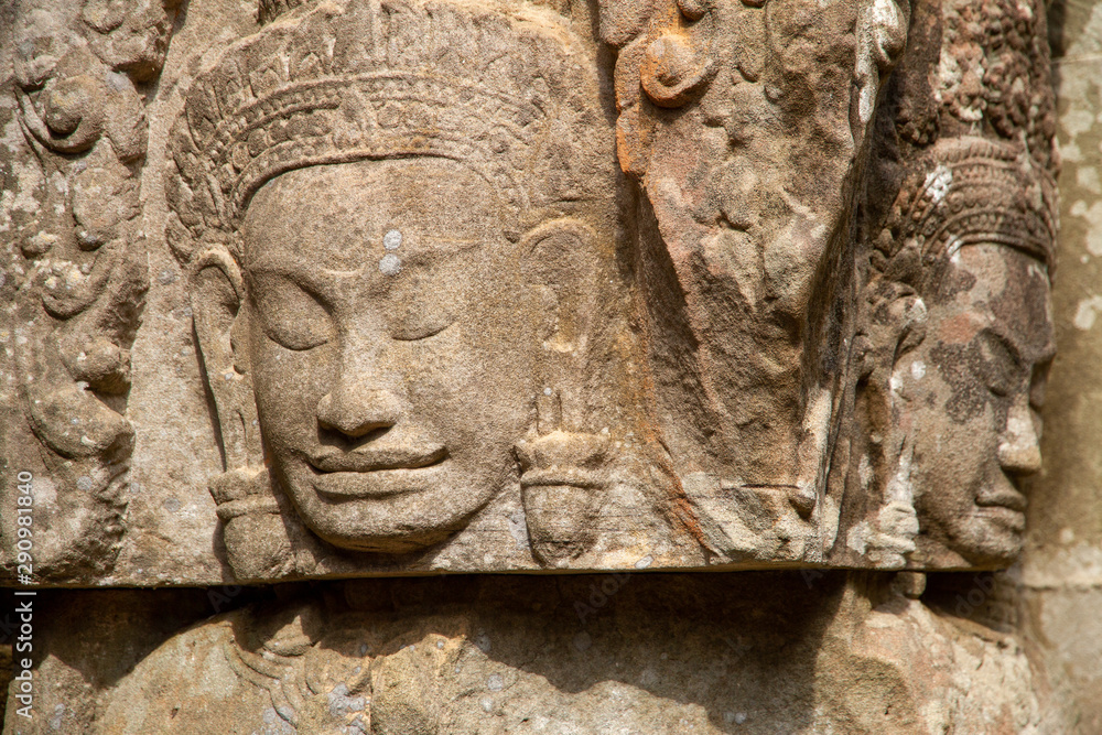 Closeup of faces carved in relief, Angkor Wat, Cambodia