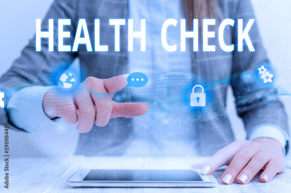 Writing note showing Health Check. Business concept for Medical Examination Wellness and general state Inspection Female human wear formal work suit presenting smart device Writing note showing Health Check. Business concept for Medical Examination Wellness and general state Inspection Female human wear formal work suit presenting smart device