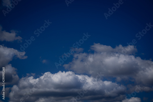 Fototapeta Naklejka Na Ścianę i Meble -  Clouds with shadow at the bottom of the picture. Against the background of the blue sky. Horizontal orientation.