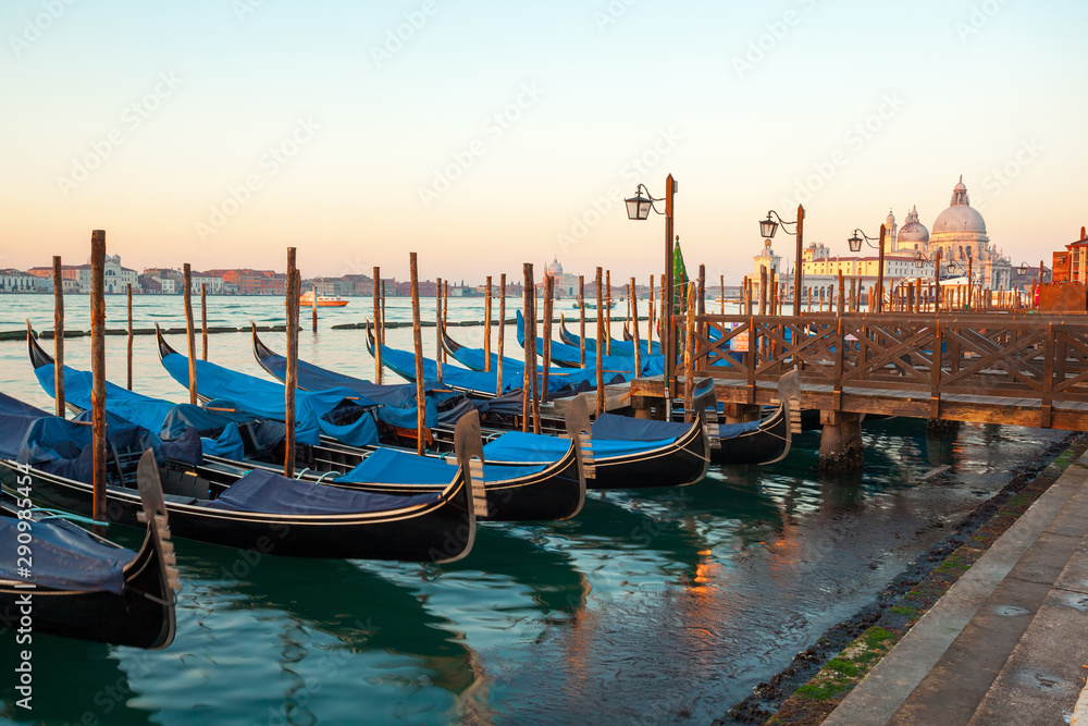Gondolas by Saint Mark square at sunrise, Venice, Italy