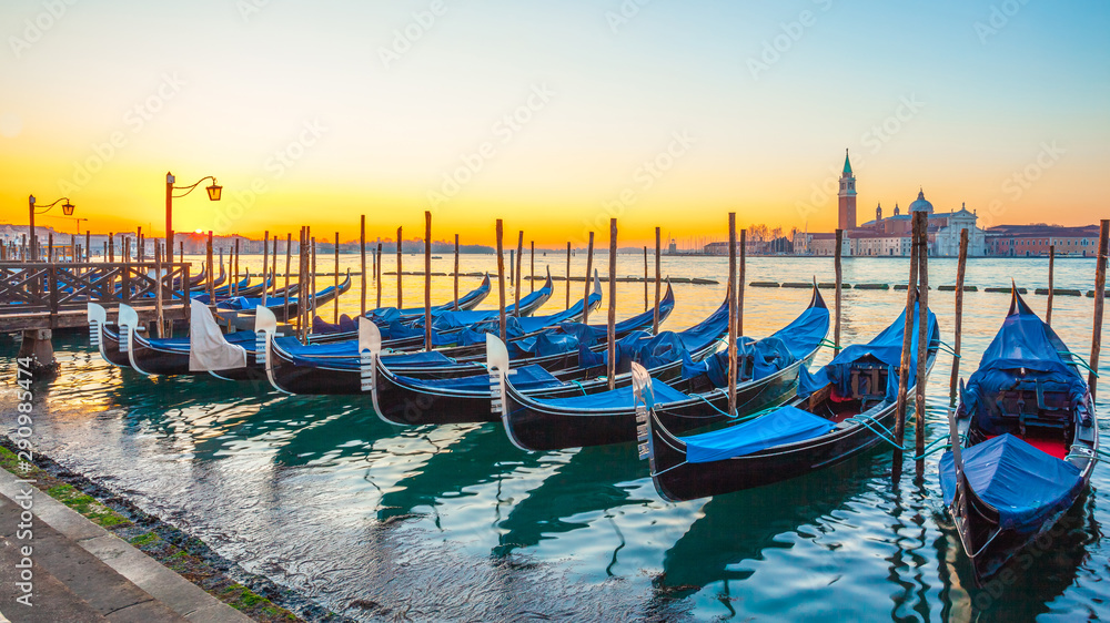 Sunrise at Venice with gondola and island of st george view from the square San marco Sunrise at Venice with gondola and island of st george view from the square San marco