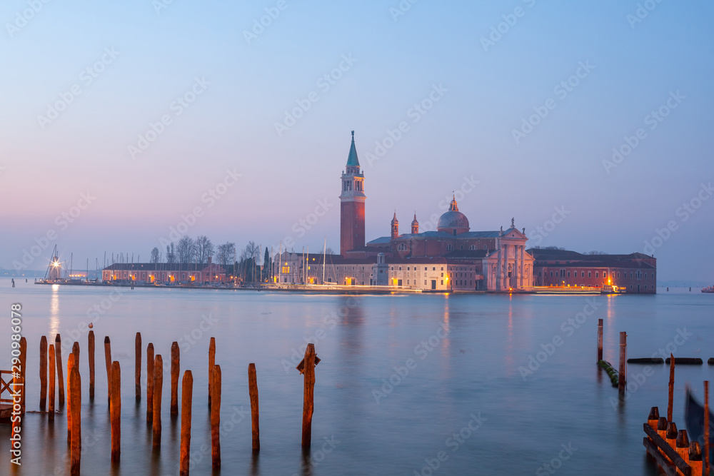 Sunrise at Venice with gondola and island of st george view from the square San marco