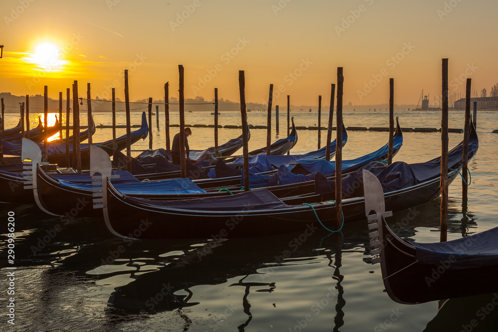 Gondolas by Saint Mark square at sunrise, Venice, Italy