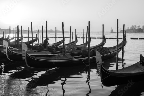 Gondolas by Saint Mark square at sunrise, Venice, Ita B&Wly