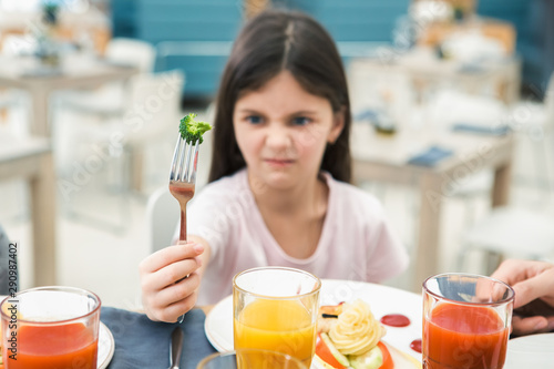 Slika na platnu Family Sitting Together in the Restaurant Lunch Concept
