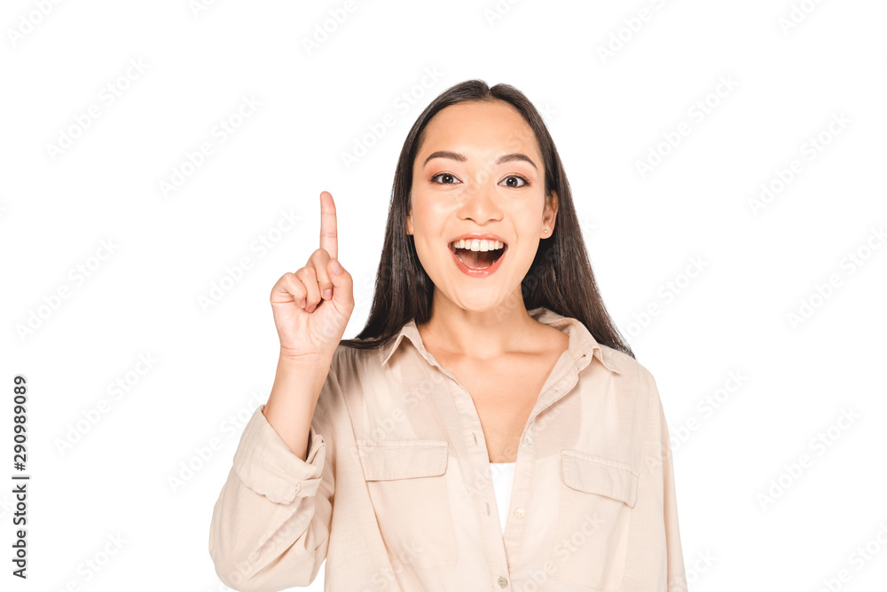cheerful asian woman showing idea sign while looking at camera isolated on white cheerful asian woman showing idea sign while looking at camera isolated on white
