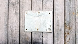 Sign boards on a rustic wooden wall mockup. vintage frames on an old wooden wall. Gray wooden background texture with copy space. wall wood table