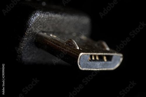 Close up of an Micro B sized of Universal Serial Bus (USB) cable.  photo