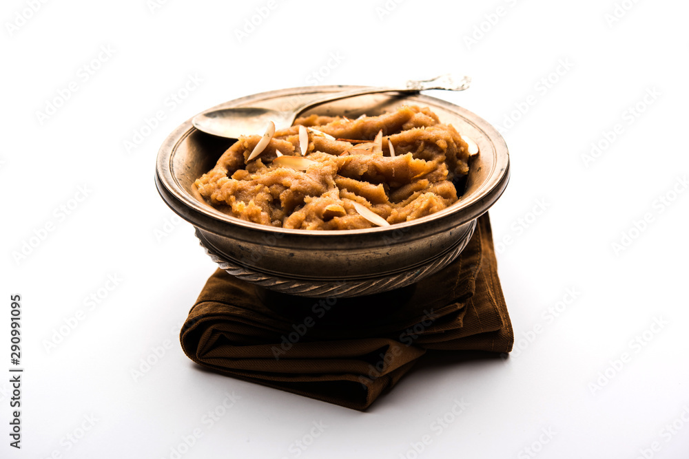 Wheat flour Halwa or Shira or porridge / Atte ka Halva, Popular healthy dessert or breakfast menu from India. served in a bowl or plate. selective focus Wheat flour Halwa or Shira or porridge / Atte ka Halva, Popular healthy dessert or breakfast menu from India. served in a bowl or plate. selective focus