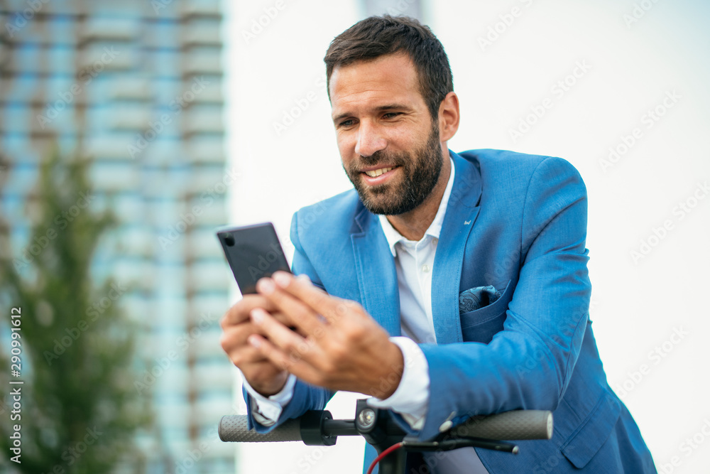 Attractive businessman using phone Attractive businessman using phone