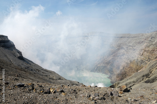 Mount Aso, Beautiful Panorama Aerial View Smoke Gas Steam Crater Caldera largest active Volcano in Japan Island eruption under Sunny Clear Blue Sky in Summer Daytime, Kumamoto, Kyushu.