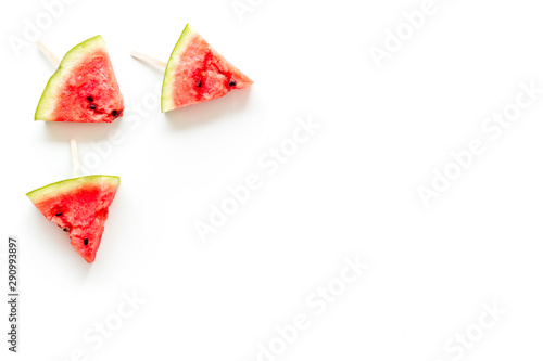 Slices of watermelon popsicle on white background top view mock up