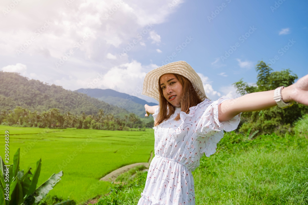 A beautiful asian woman enjoy with feeling happy and relaxed in the nature