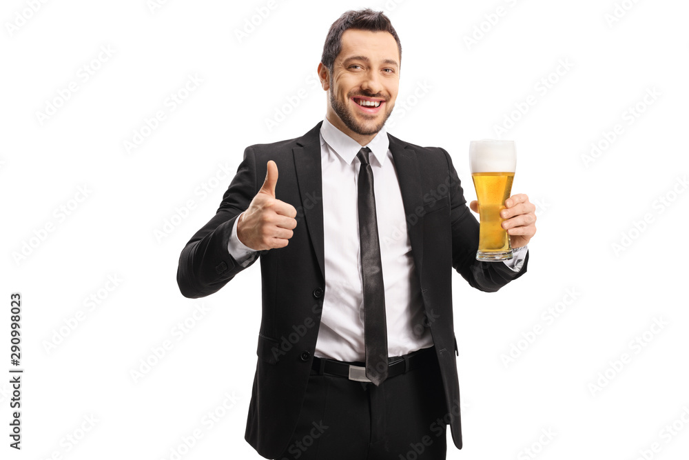 Cheerful businessman holding a glass of beer and showing thumbs up Cheerful businessman holding a glass of beer and showing thumbs up