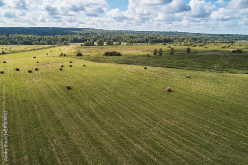 Agricultural field with bales of straw. Aerial photography from the drone