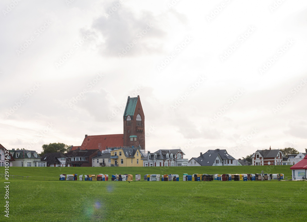 Levee of Cuxhaven (Döse) with the St. Petri Church and other Buildings in the background Levee of Cuxhaven (Döse) with the St. Petri Church and other Buildings in the background