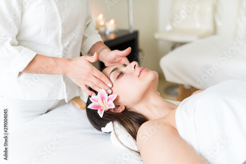 Pretty Latin Woman Receiving Massage From Therapist