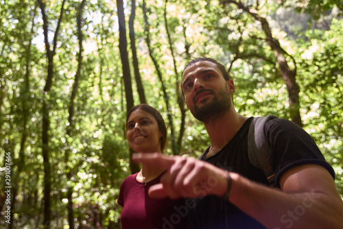 Young man pointing at something of interest