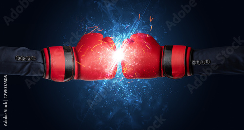 Two hands fighting with light, glow, spark and smoke concept © ra2 studio