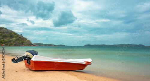 Bild auf Leinwand Orange color motor boat at Marble beach in Trincomalee, Sri Lanka