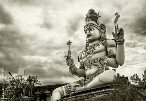 God Shiva statue at Hindu temple in Koneswaran. Grayscale image. Black and white