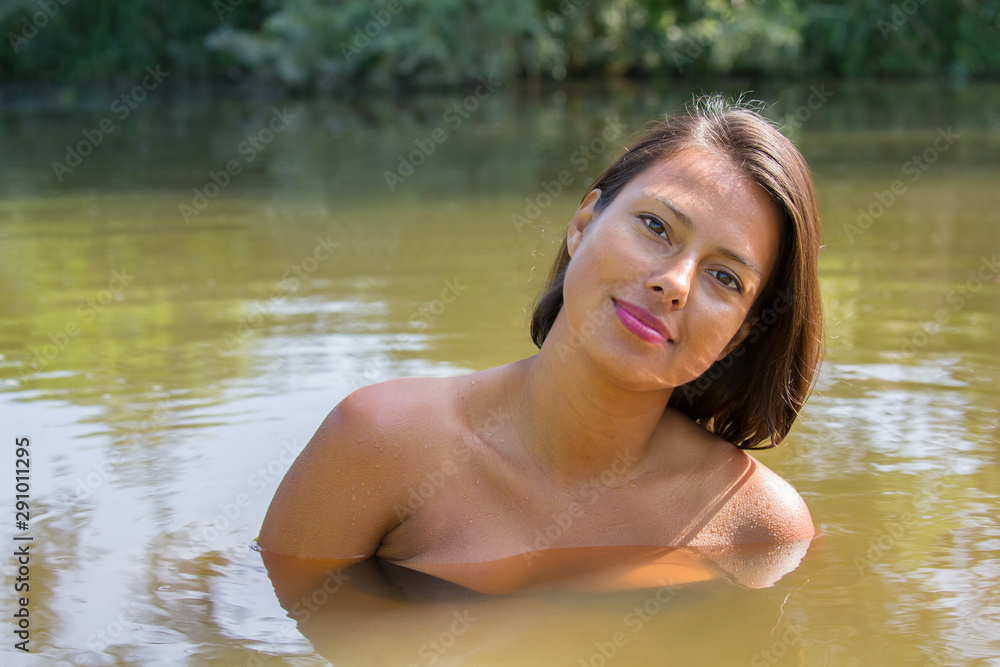 Portrait pretty woman in natural water