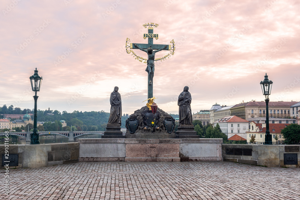Statuary of the Holy Crucifix and Calvary on Charles Bridge in Prague, Czech Republic.