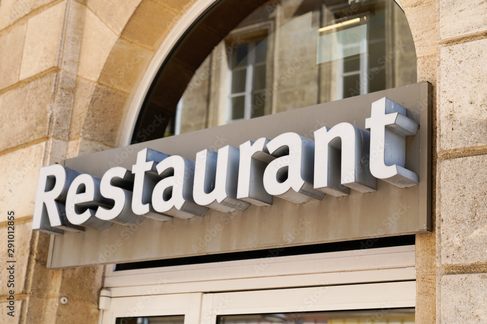restaurant sign neon on a city street storefront restaurant sign neon on a city street storefront