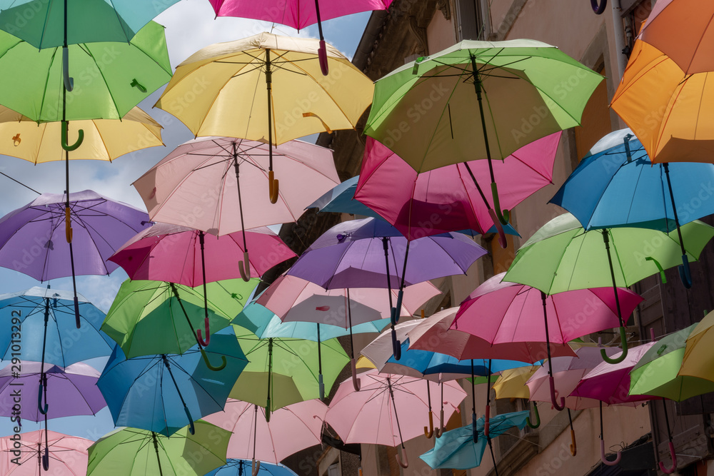 background with colored umbrellas on one street