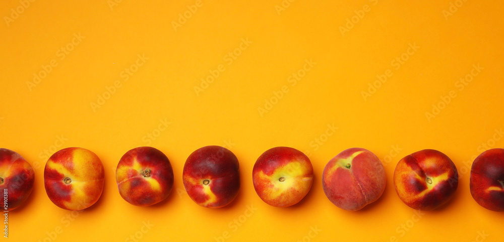 Flat lay composition with ripe peaches on orange background, space for text Flat lay composition with ripe peaches on orange background, space for text
