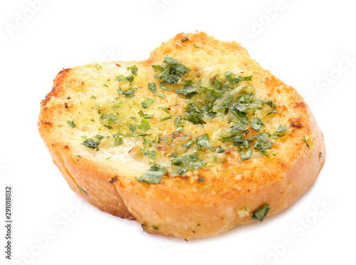 Slice of bread with garlic, cheese and herbs on white background