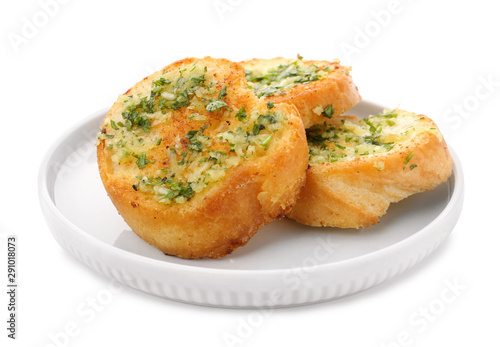 Slices of toasted bread with garlic and herbs on white background