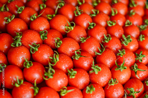 ripe juicy red tomatoes with leaves