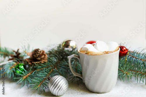 Christmas white background with coffee and decorative fir branches, new year card