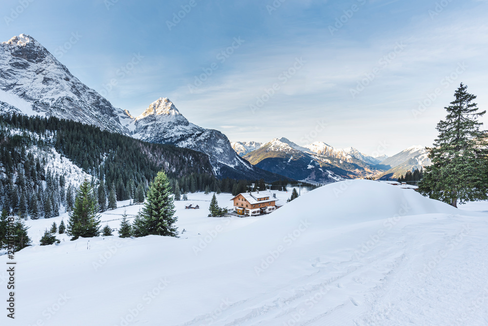 Winter landscape with the snow-covered Alps and the fluffy snowdrifts