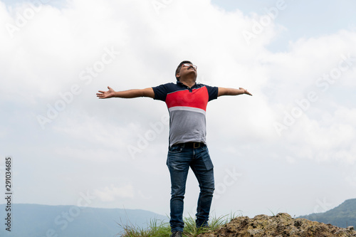 A man streaching hands and relaxing in outdoors photo