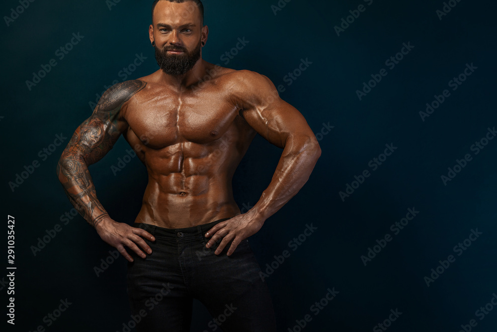 Strong and fit man bodybuilder. Sporty muscular guy athlete. Sport and fitness concept. Men's fashion. Strong and fit man bodybuilder. Sporty muscular guy athlete. Sport and fitness concept. Men's fashion.