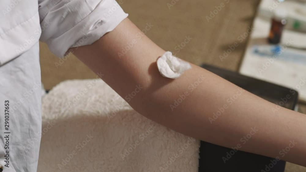 Sick caughing woman getting syringe drug injection by an experienced