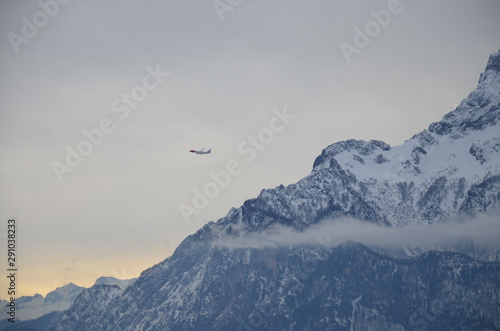Airplane and mountain.