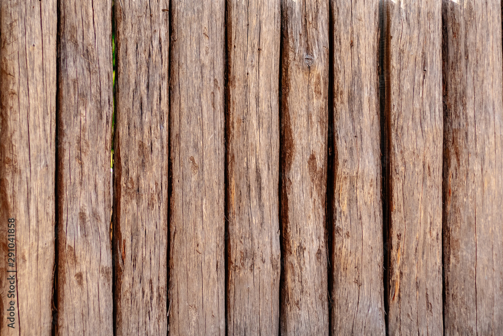 Wooden wall from logs of pine as a background texture Wooden wall from logs of pine as a background texture
