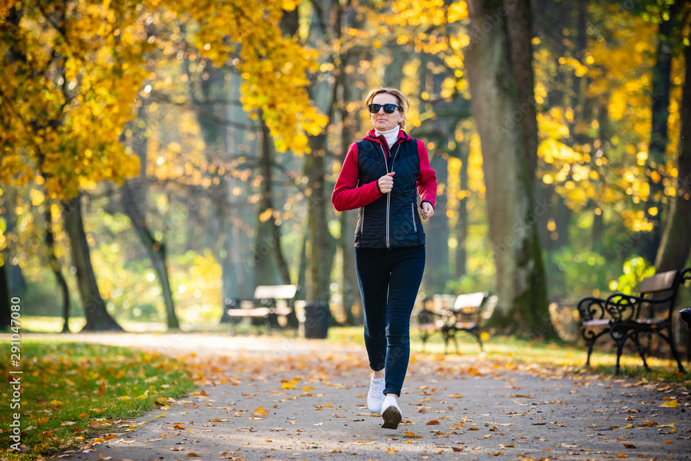 Fototapeta premium Healthy lifestyle - woman running in city park