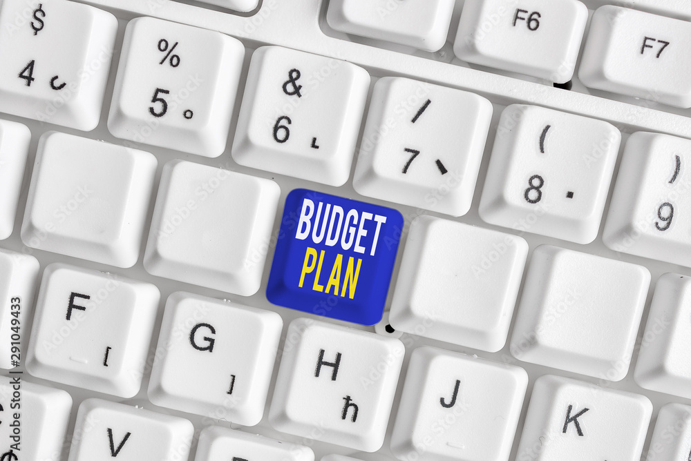 Conceptual hand writing showing Budget Plan. Concept meaning financial schedule for a defined period of time usually year White pc keyboard with note paper above the white background Conceptual hand writing showing Budget Plan. Concept meaning financial schedule for a defined period of time usually year White pc keyboard with note paper above the white background