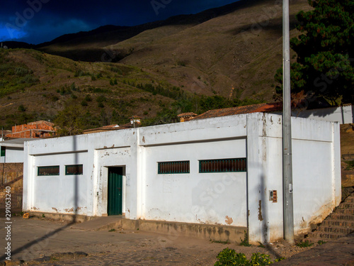 The public toilet building at the marketplace of the colonial town of Villa de Leyva, at sunset, in the Andean mountains of central Colombia. © Mauricio Acosta
