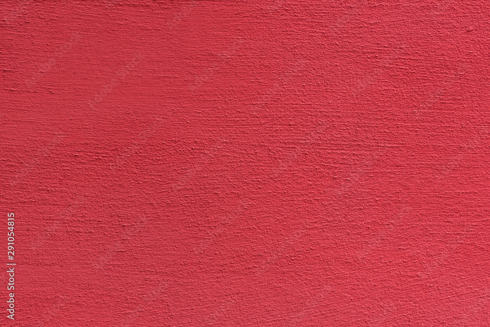 Fototapeta premium Bright rough plastered surface. Living coral colored. Backgrounds and textures