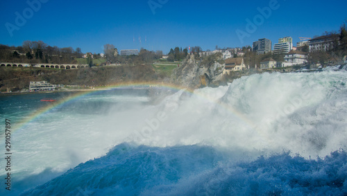 Amazing Rainbow in a beautiful day at the Rhine Falls in Switzerland , those amazing waterfalls considered as the widest in Europe for a good reason , its HUGE !